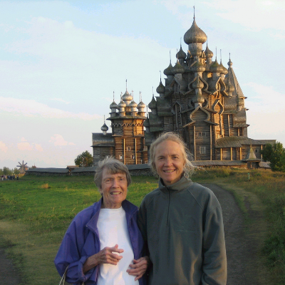 Opal and Marcia Sloane standing in front of an opulent building