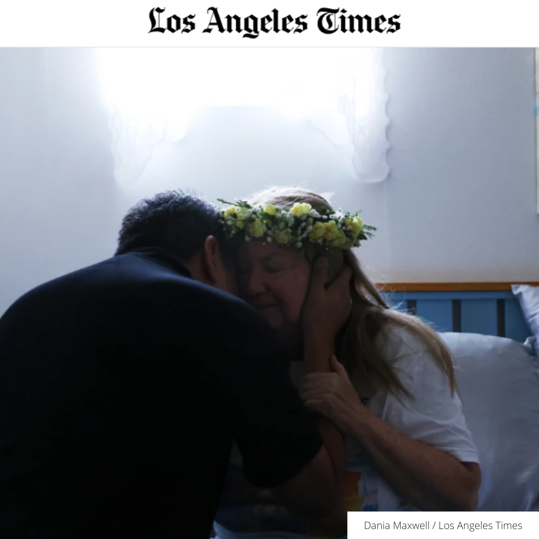 Rudy Sanzana, a friend of more than 30 years, hugs Gabriella Walsh one last time before she dies through medical aid on July 16 in Santa Paula. “I just feel like I’m going on a trip,” Gabriella said calmly.(Dania Maxwell / Los Angeles Times)