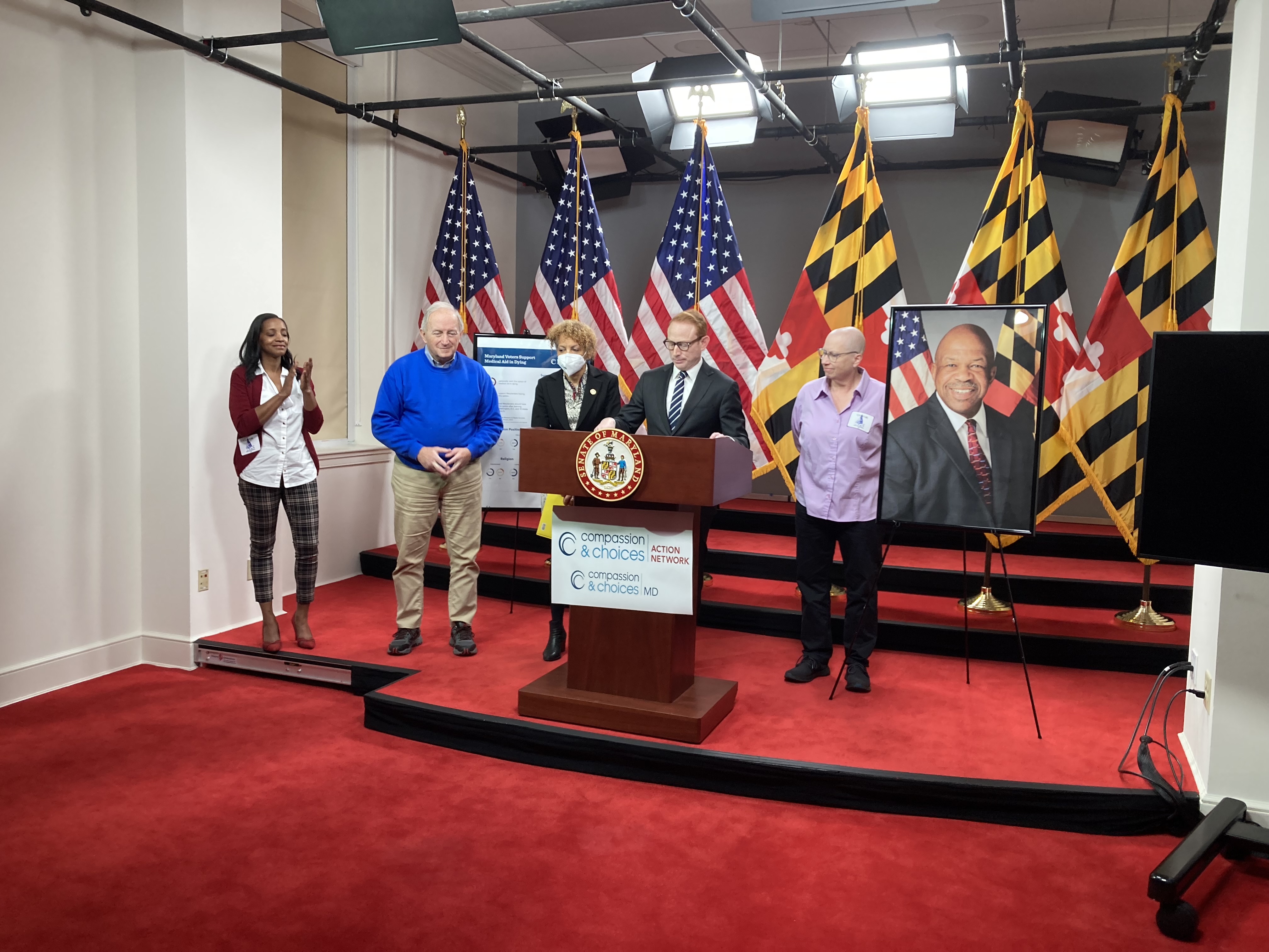 Brandi Alexander,  Terry Lierman, Del. Terri Hill, Sen. Jeff Waldstreicher, and Diane Kraus speaking at Annapolis news conference in support of Maryland End-of-Life Option Act.