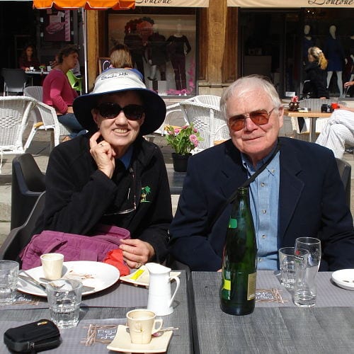 Jane and Jay Roberts seated at an outdoor table in France