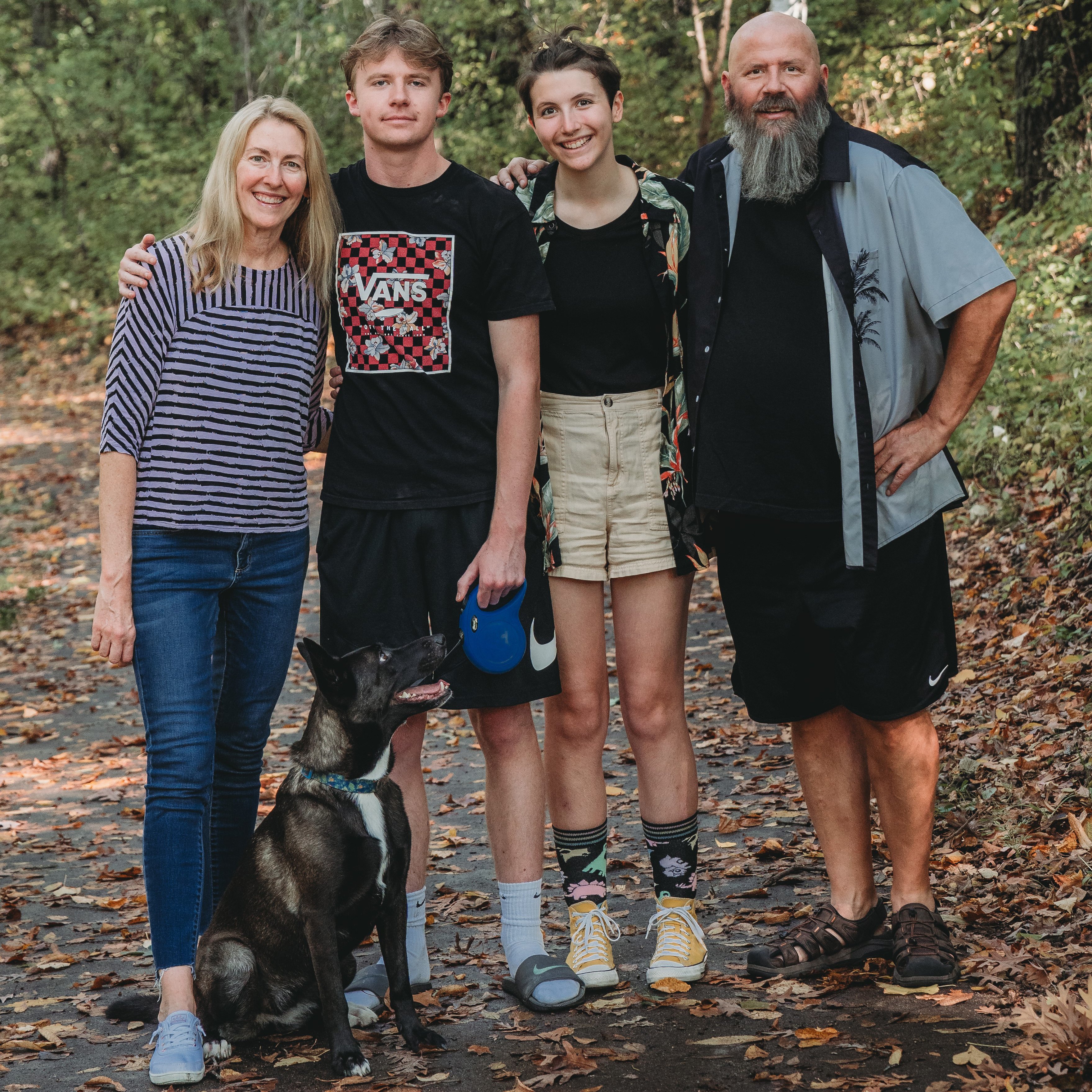 Jeff McComas hiking with his family and his dog