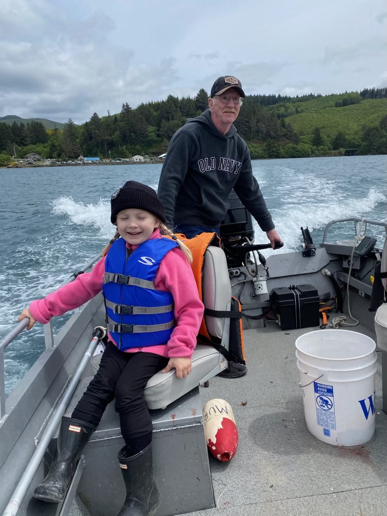 Paul Murphy and his granddaughter on a boat.